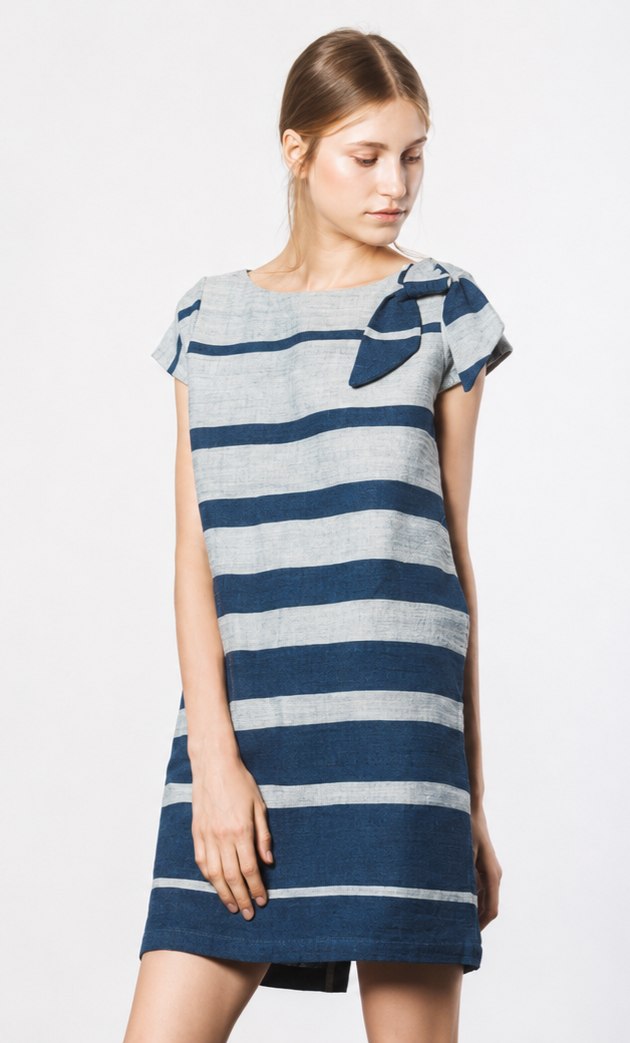 A model wearing a striped indigo-dyed shift dress