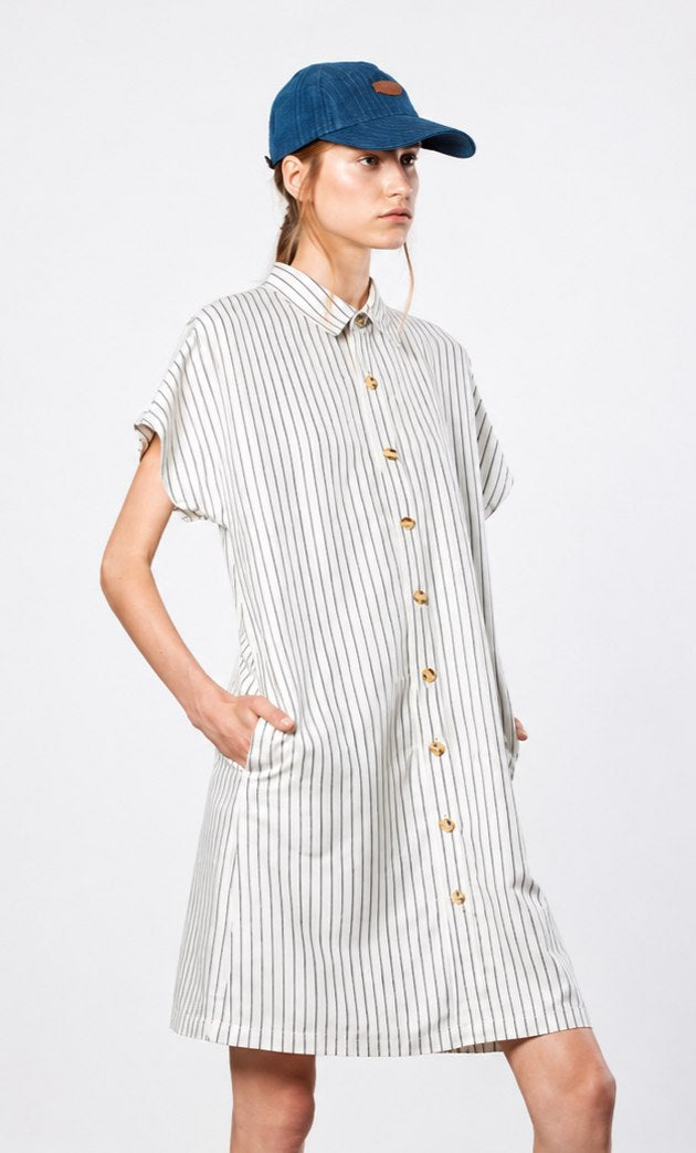A model wearing a striped indigo-dyed shirtdress